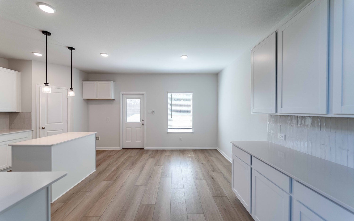 Newly finished kitchen with clear worktops, fitted cabinetry and clean floors